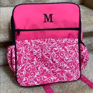 Pink and white backpack with letter M initial